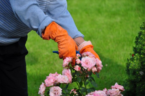 Workers sorting garden waste for compost and recycling